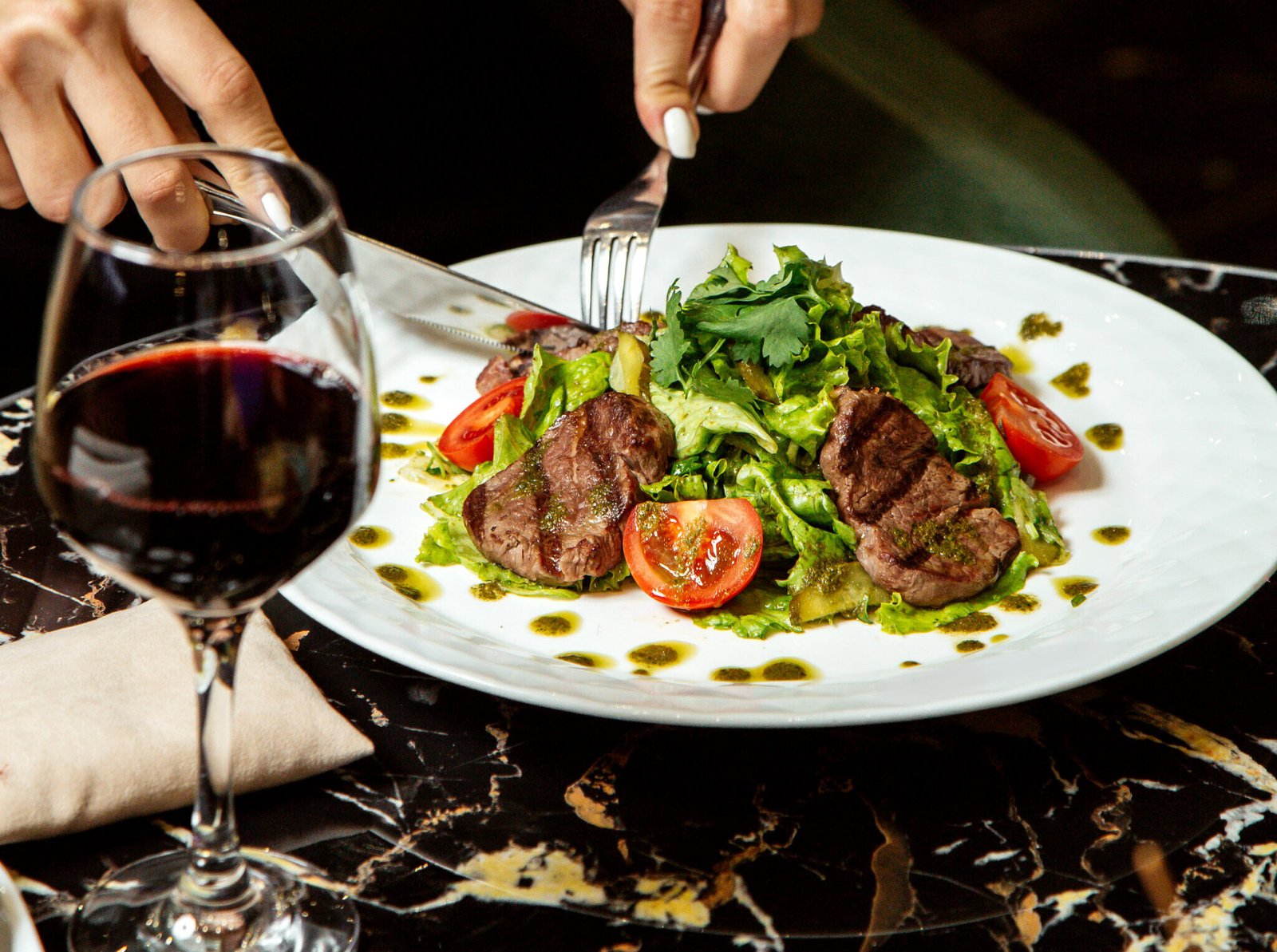 vegetable salad topped with fried meat slices